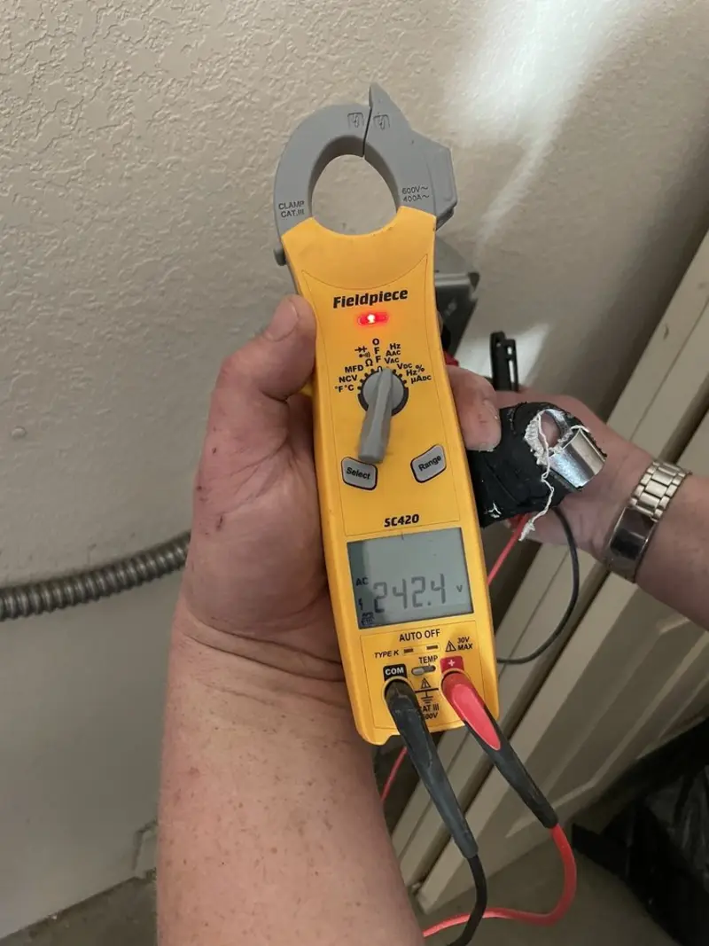 Voltage testing with clamp meter during Recessed Lighting Installation in Johnston